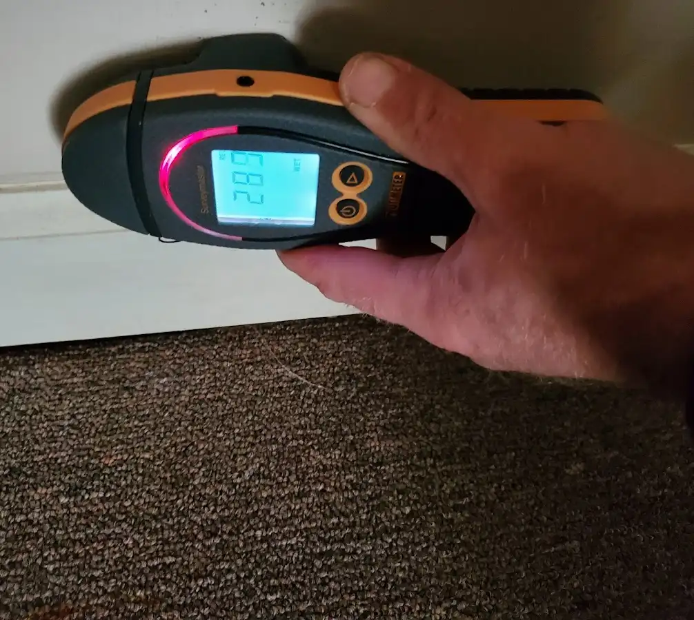 Moisture detection at baseboard during Storm Damage Restoration in Haverstraw
